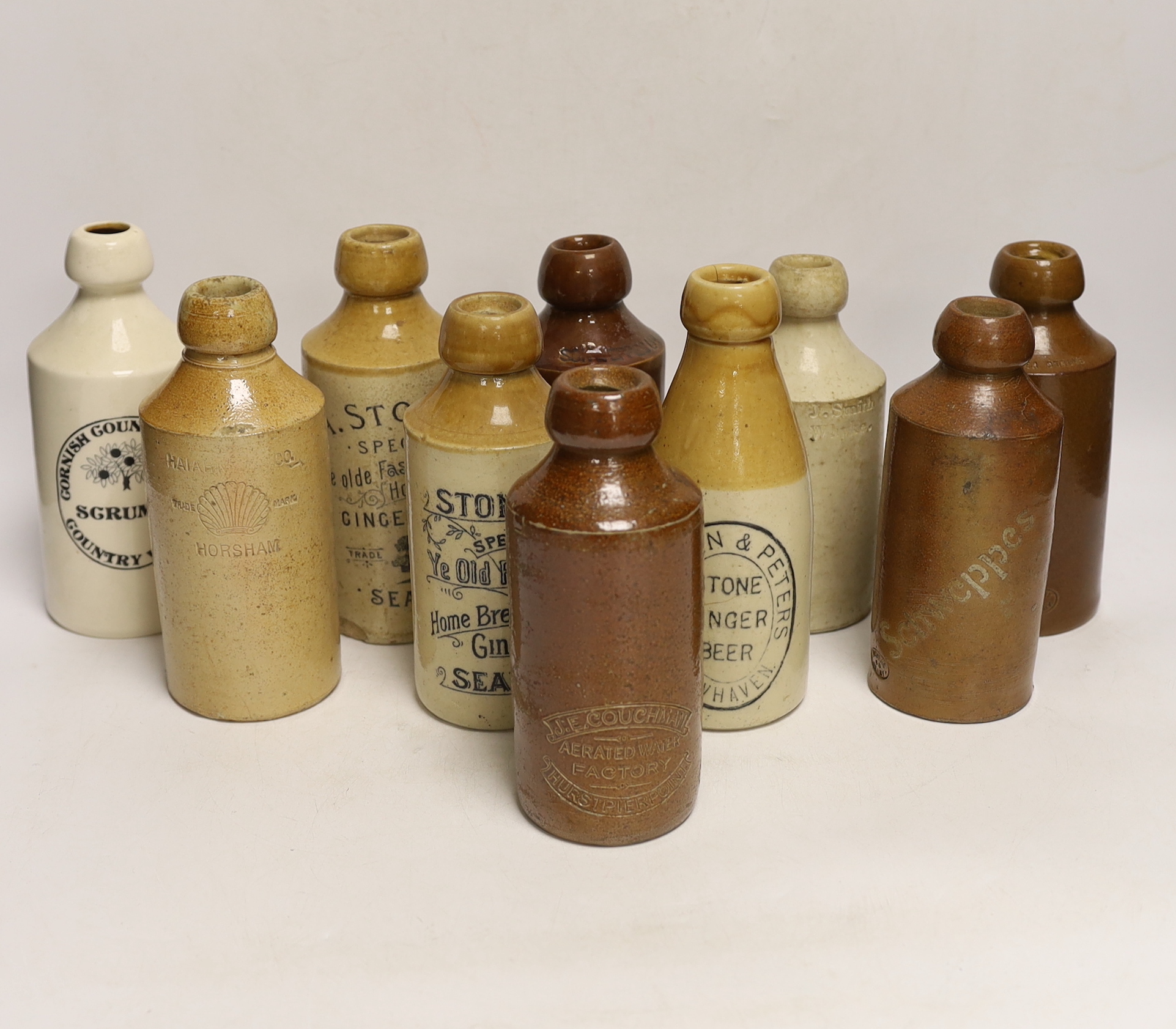 Early 20th century stoneware ginger beer bottles, one Hurstpierpoint, one Horsham, two Seaford and four others
